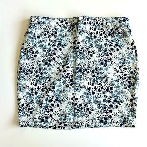 Blue Westport pencil skirt with floral and butterfly pattern and front pockets.